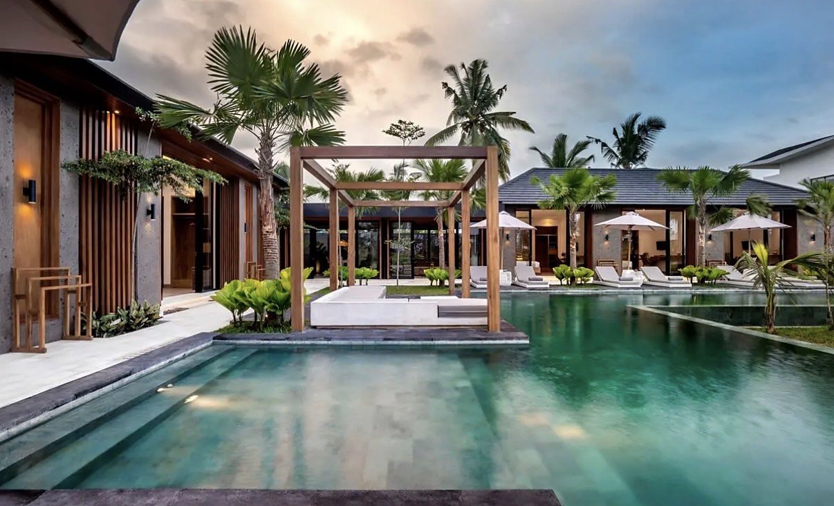 Our villa from the March 2026 Bali trip, pool and palm trees at dusk
